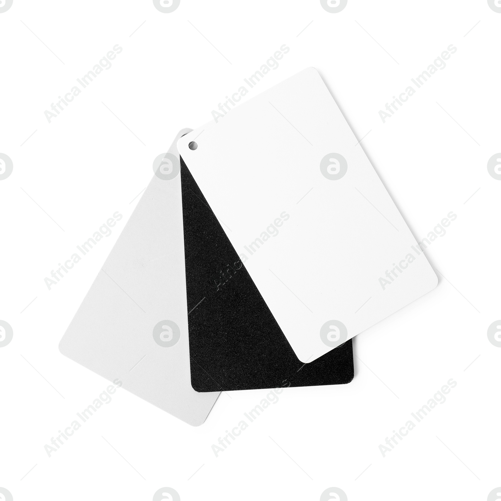 Photo of White balance calibration cards on white background, top view