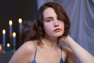 Photo of Beautiful young woman in room, closeup. Fashion vintage style portrait