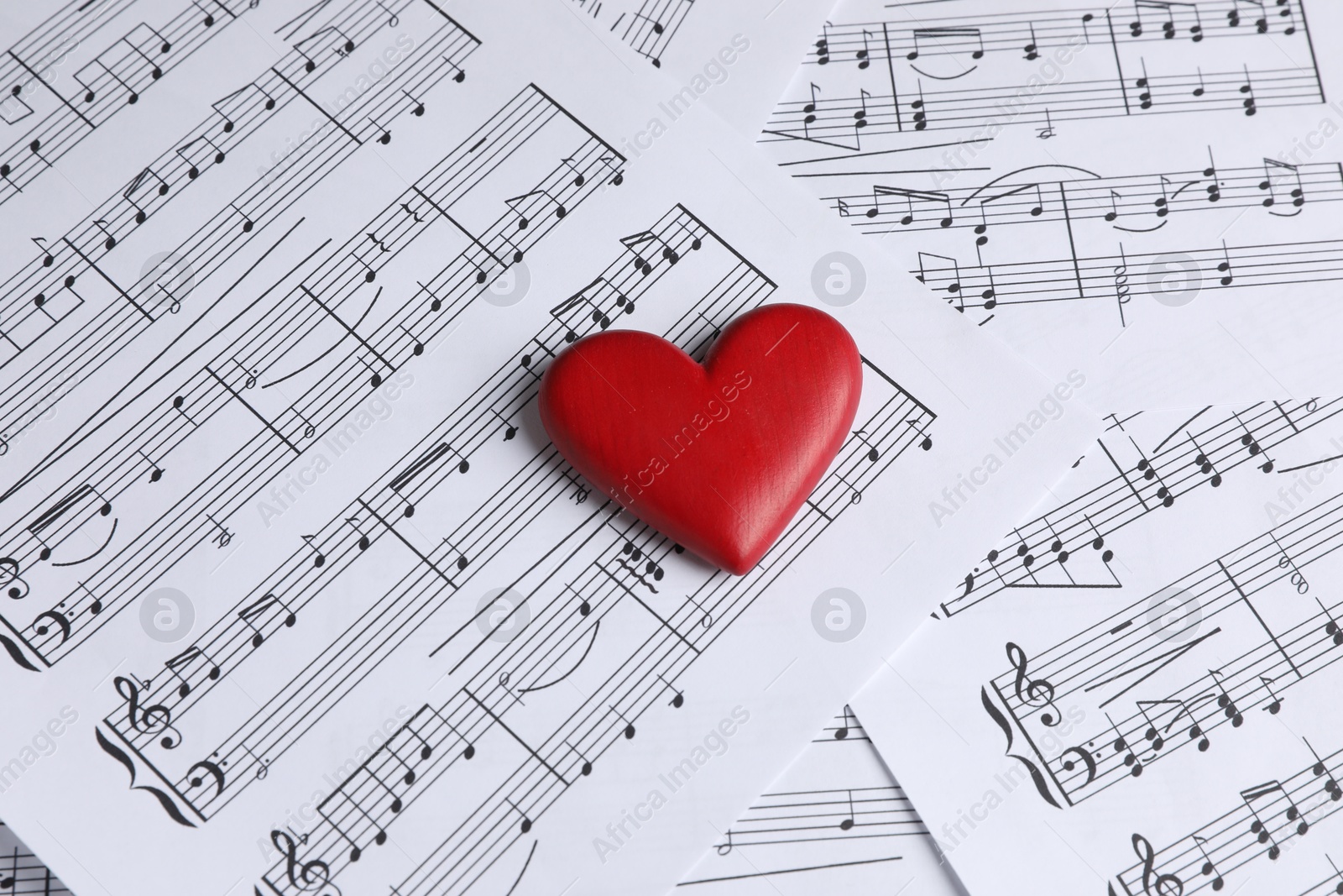 Photo of Heart figure on musical note sheets, closeup