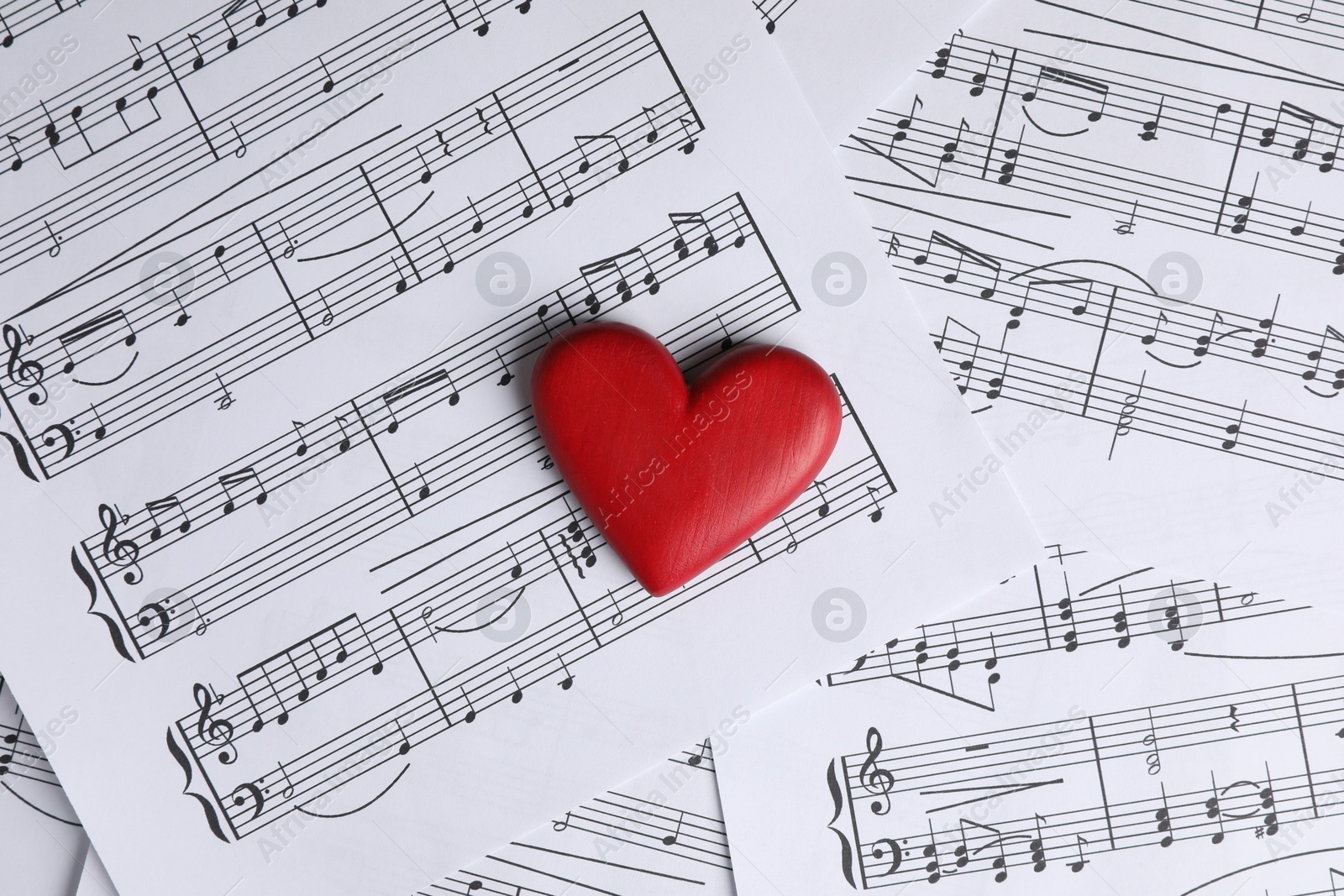 Photo of Heart figure on musical note sheets, top view