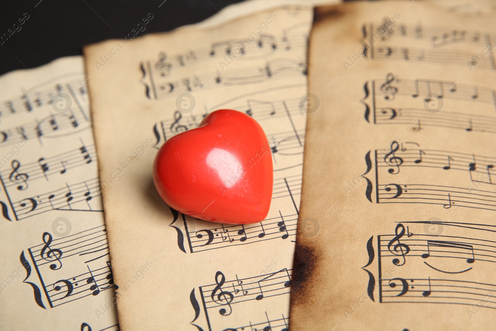 Photo of Heart figure on musical note sheets, closeup