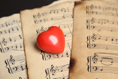 Photo of Heart figure on musical note sheets, closeup