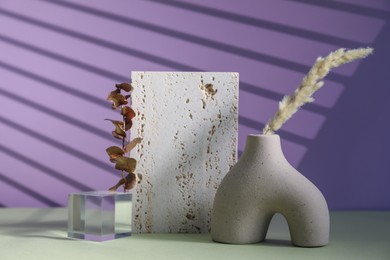 Photo of Stylish presentation of vase on color background