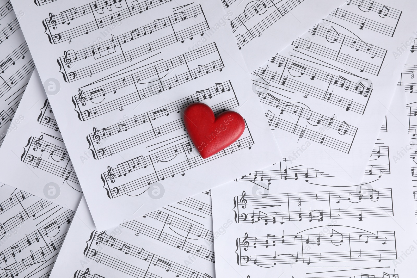 Photo of Heart figure on musical note sheets, top view