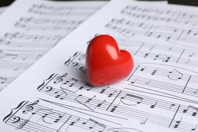 Heart figure on musical note sheets, closeup