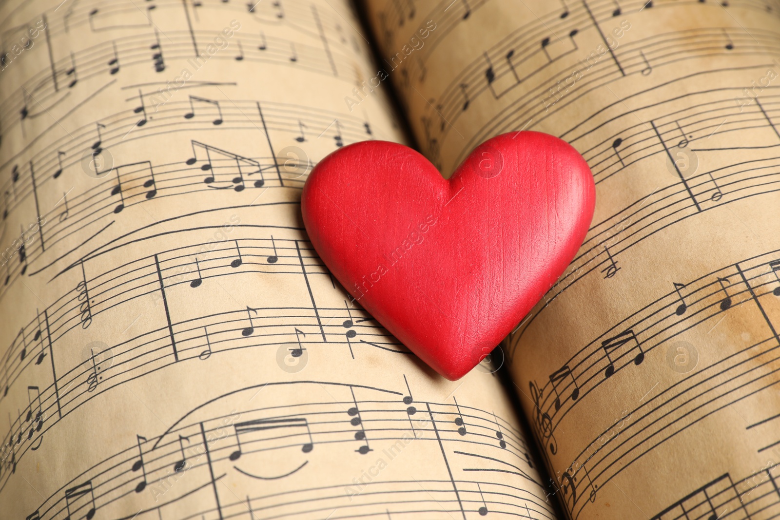 Photo of Heart figure on musical note sheets, closeup