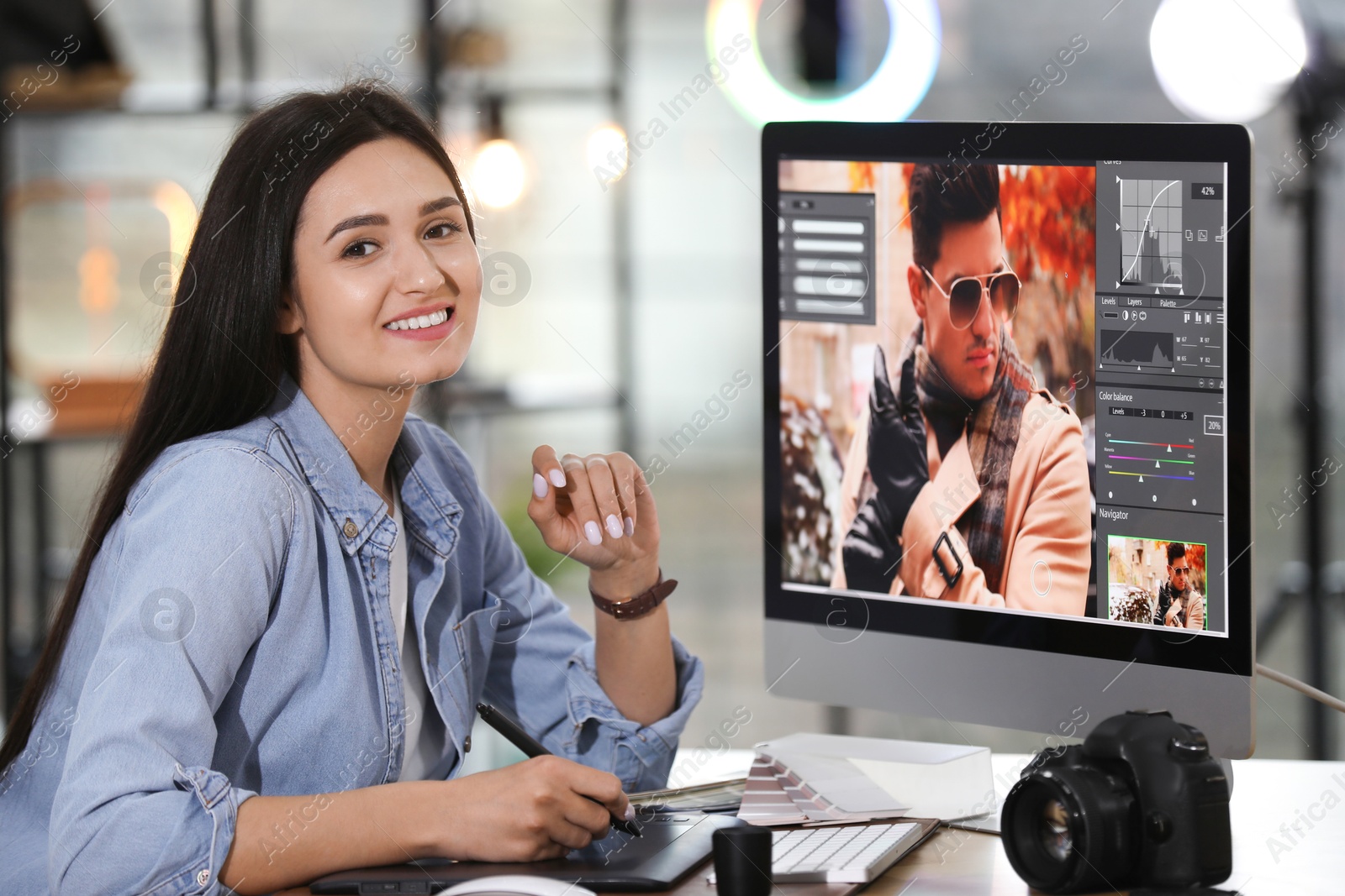 Photo of Professional retoucher working on computer in office