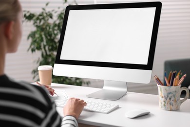 Photo of Woman working with computer monitor at table in office, closeup. Mockup for design