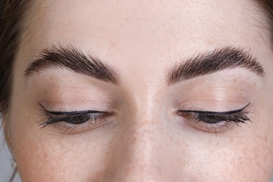 Photo of Woman after brow lamination procedure, closeup view