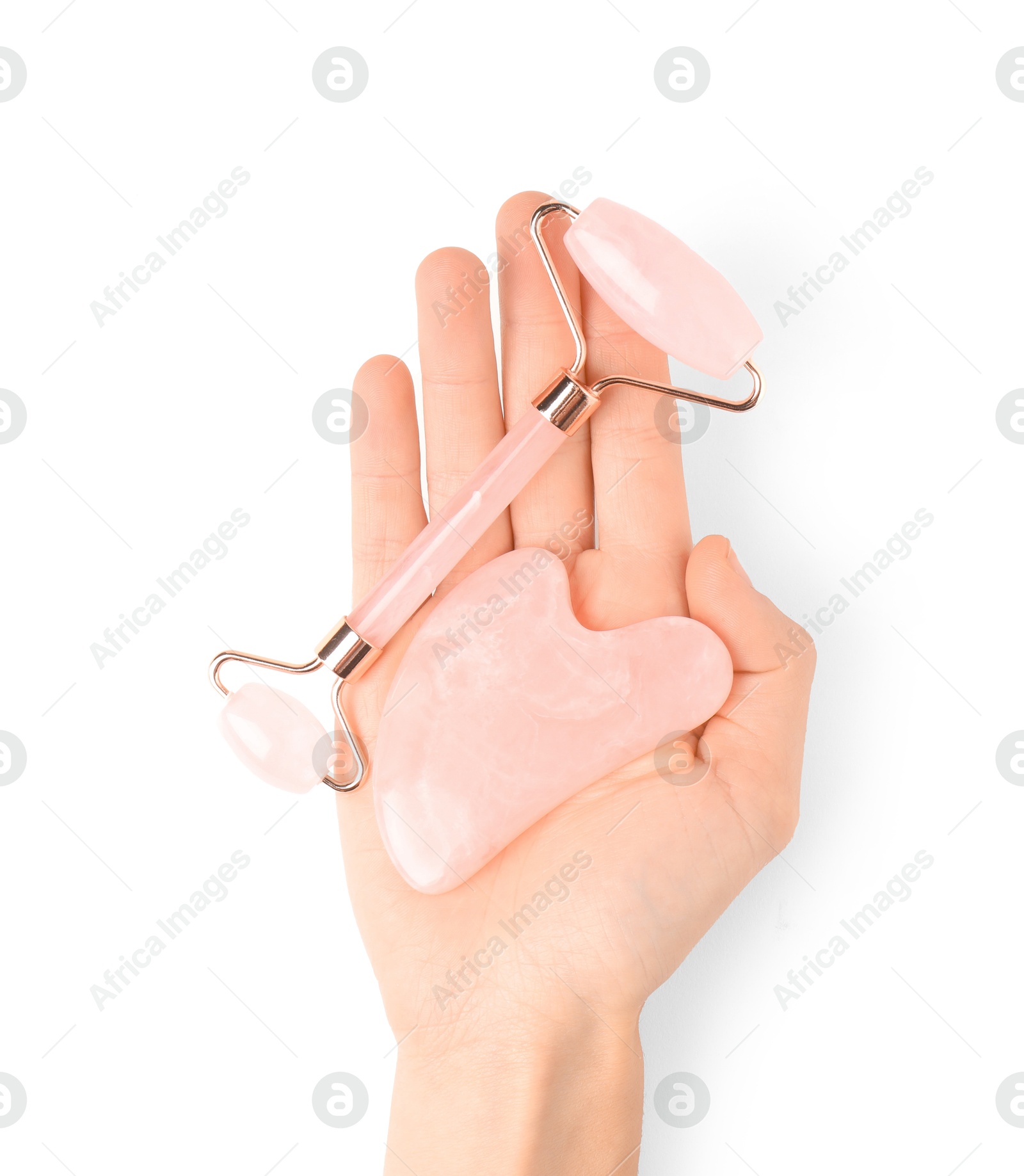 Photo of Woman with face roller and gua sha tool on white background, top view