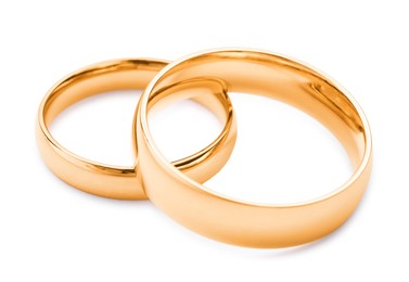 Photo of Beautiful golden wedding rings isolated on white