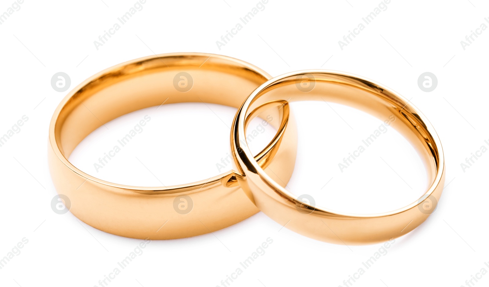 Photo of Beautiful golden wedding rings isolated on white