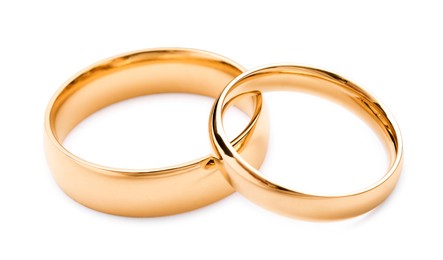 Photo of Beautiful golden wedding rings isolated on white