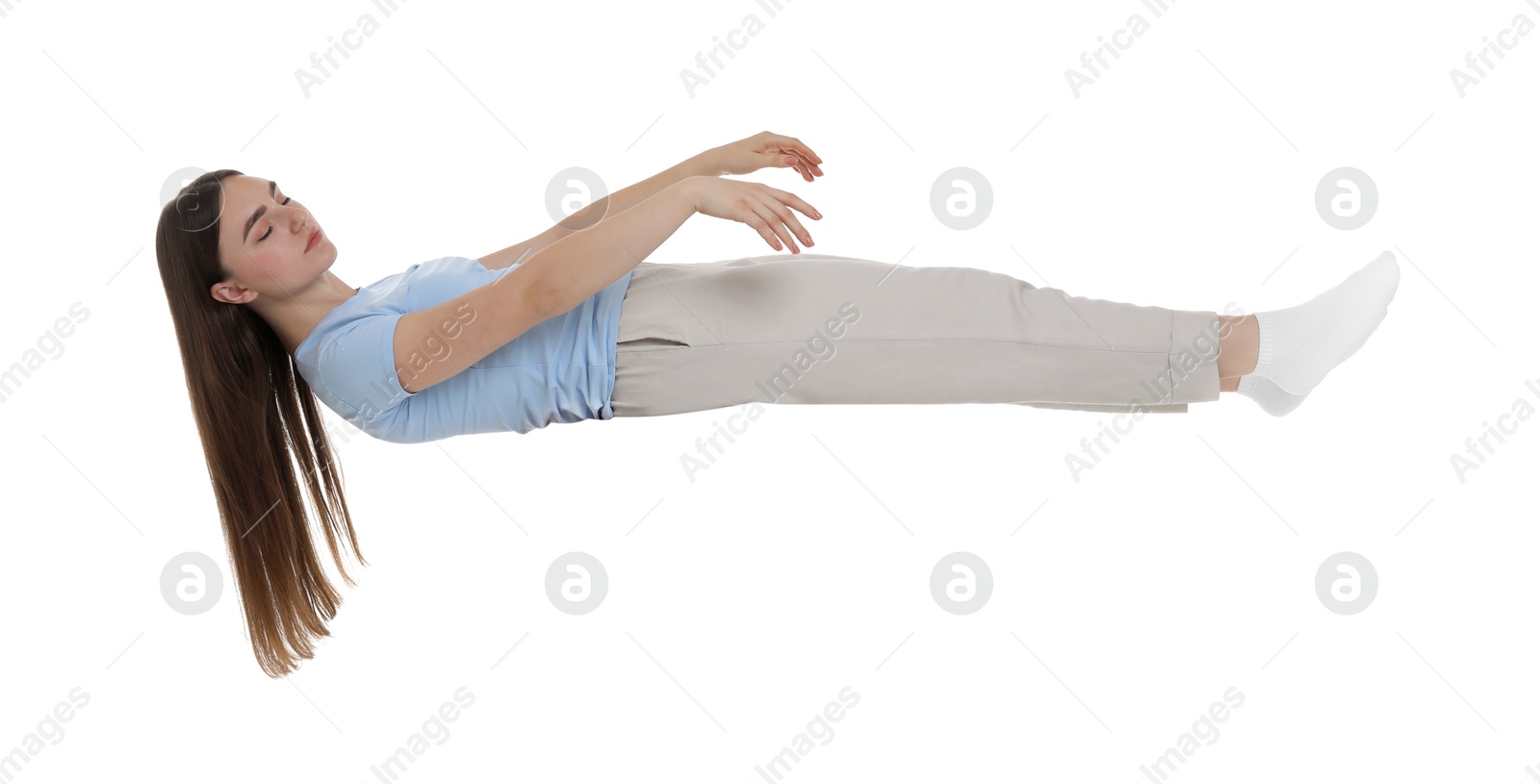 Photo of Young woman suffering from sleepwalking on chair against white background