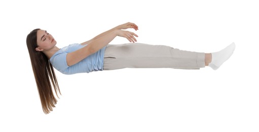 Photo of Young woman suffering from sleepwalking on chair against white background