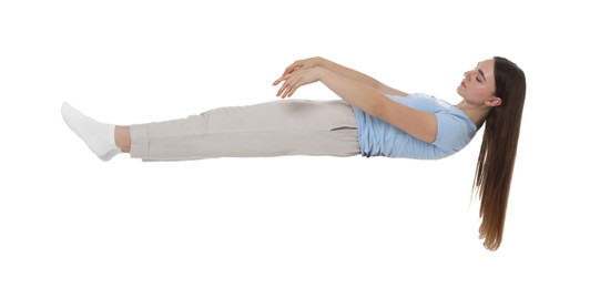 Photo of Young woman suffering from sleepwalking on chair against white background