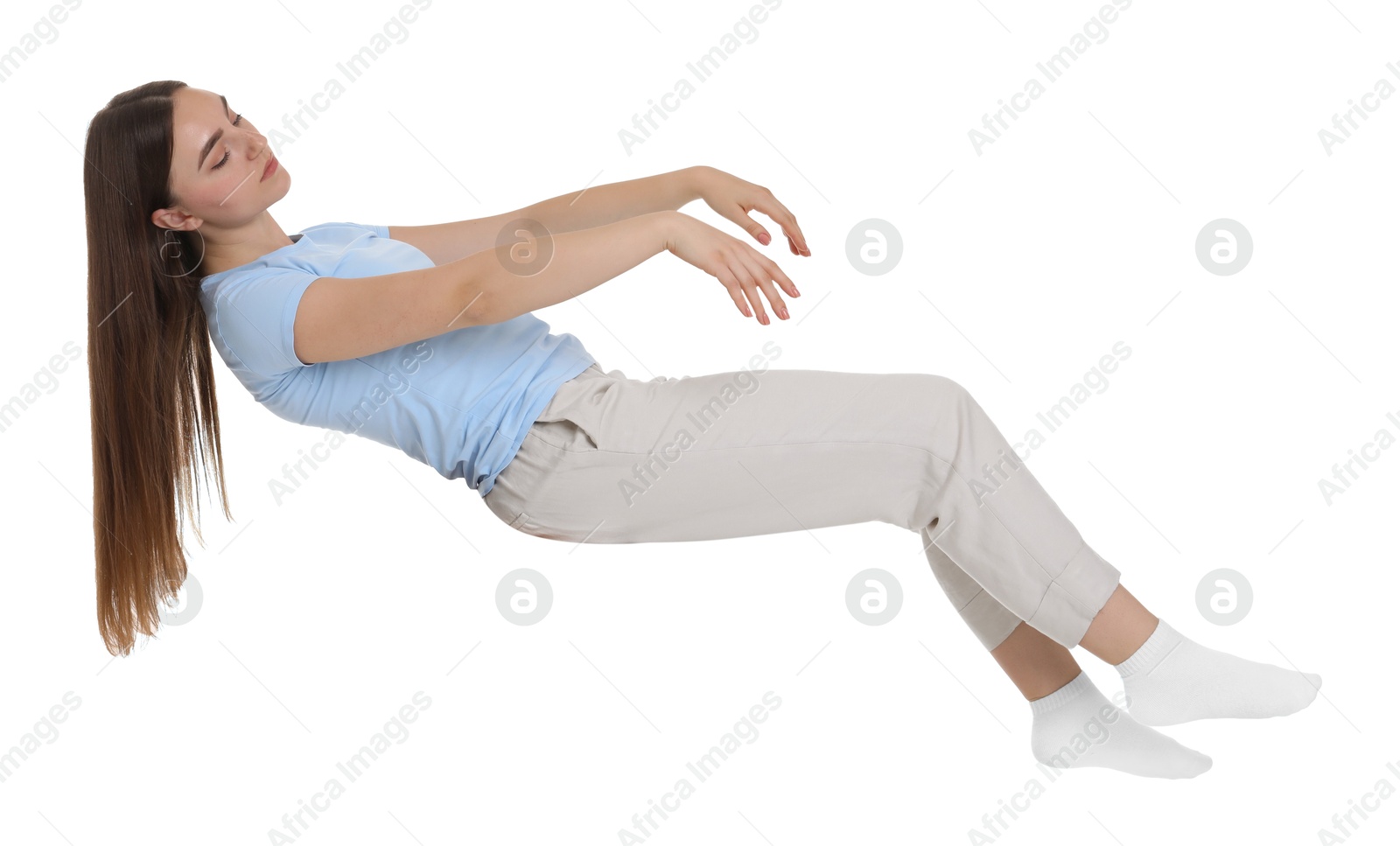 Photo of Young woman suffering from sleepwalking on chair against white background