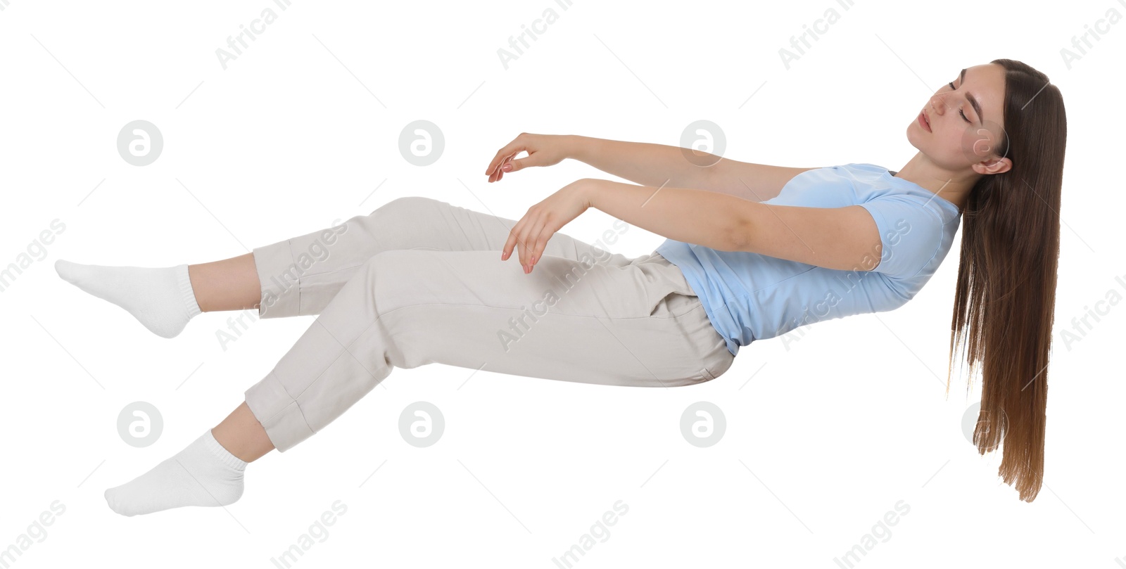 Photo of Young woman suffering from sleepwalking on chair against white background