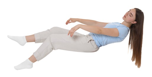 Photo of Young woman suffering from sleepwalking on chair against white background