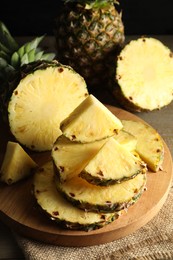 Slices of fresh ripe pineapples on table