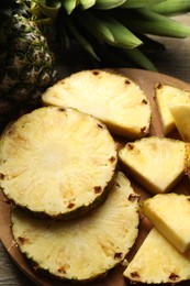 Slices of fresh ripe pineapple on table, closeup