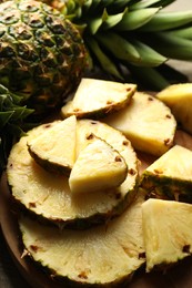 Slices of fresh ripe pineapple on table, closeup