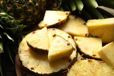 Photo of Slices of fresh ripe pineapple on table, closeup