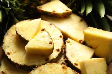 Slices of fresh ripe pineapple on table, closeup