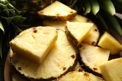 Photo of Slices of fresh ripe pineapple on table, closeup