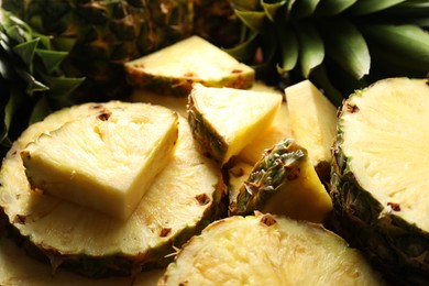 Photo of Slices of fresh ripe pineapple on table, closeup