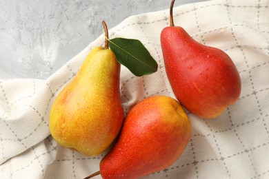 Photo of Ripe juicy pears on grey table, flat lay