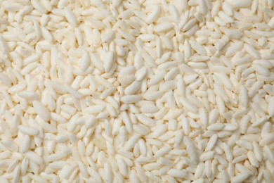 Photo of Wholegrain puffed rice as background, closeup view