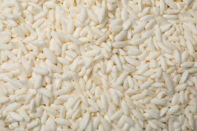 Photo of Wholegrain puffed rice as background, closeup view