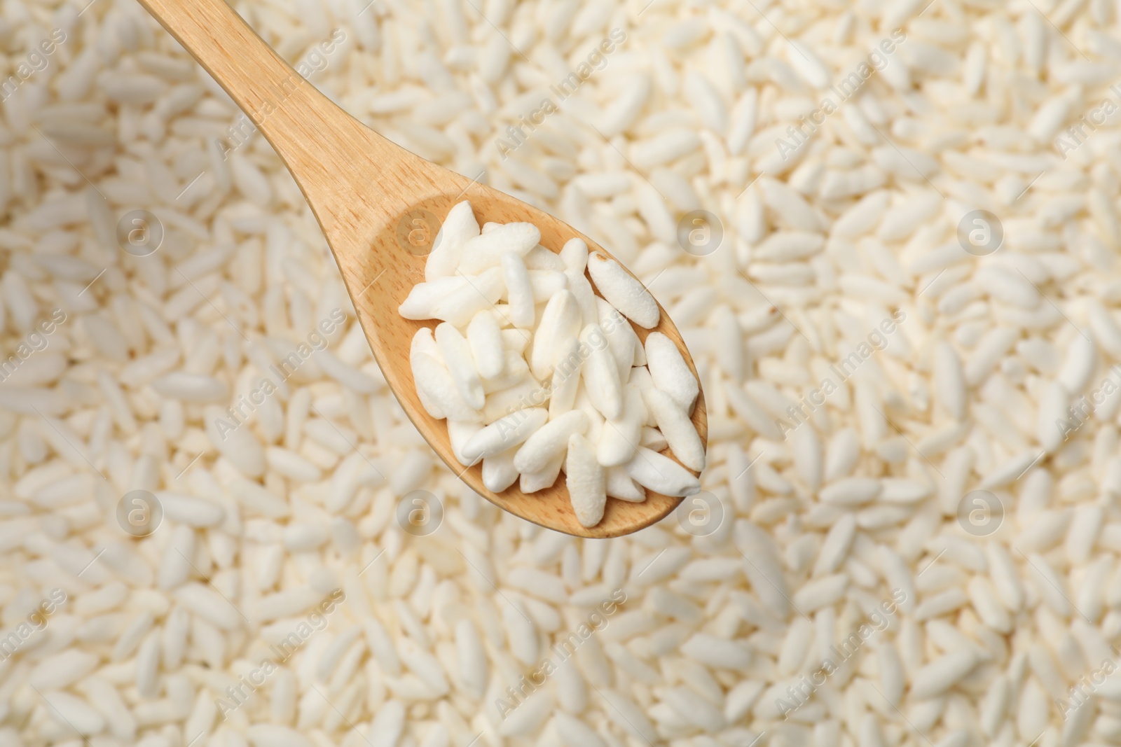 Photo of Spoon over wholegrain puffed rice, top view