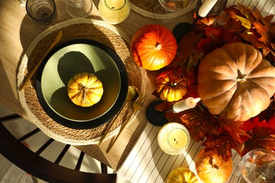 Stylish table setting with beautiful autumn decor in dining room, top view