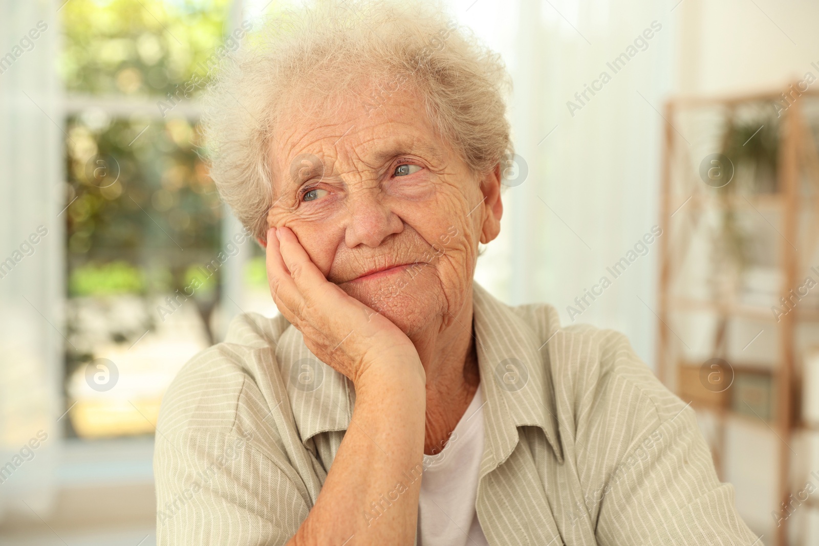 Photo of Portrait of beautiful senior woman at home