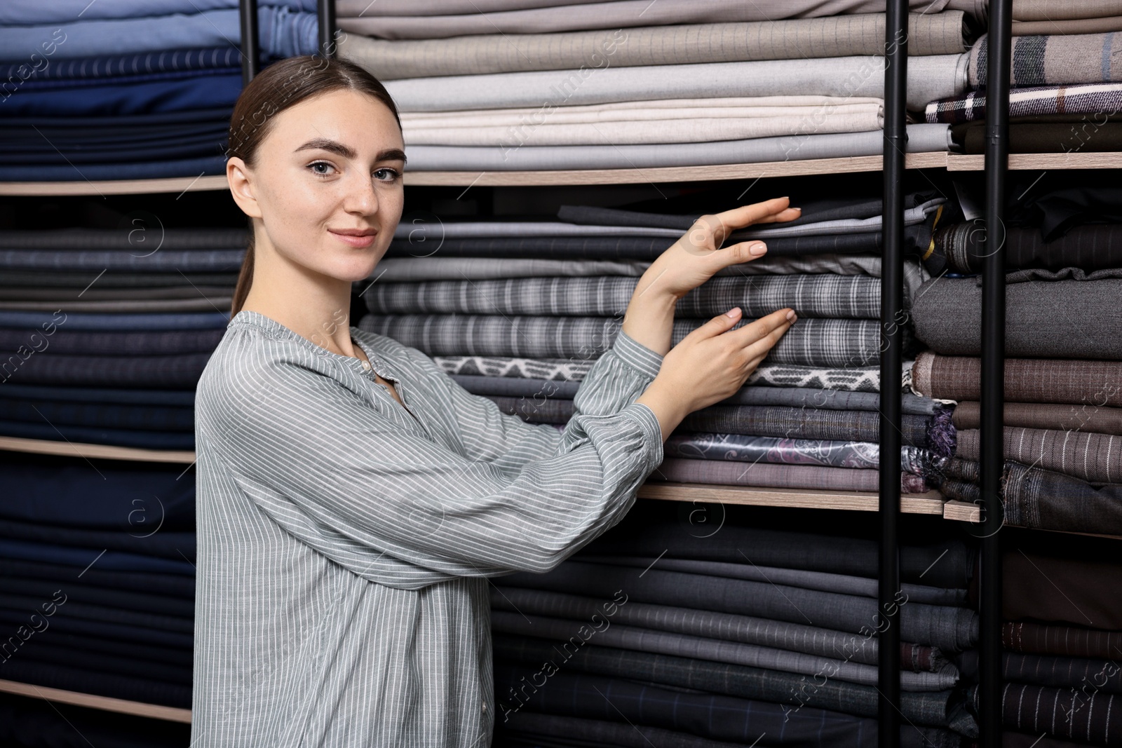 Photo of Atelier. Young woman working in professional workshop