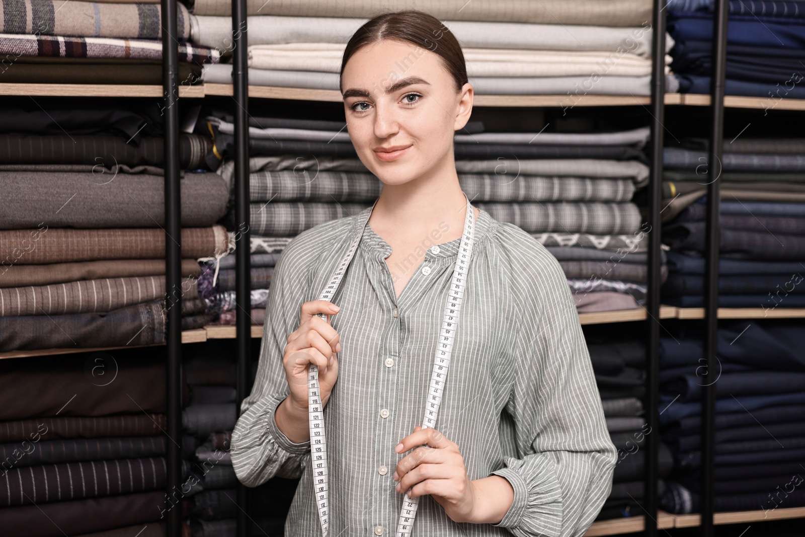 Photo of Atelier. Young woman working in professional workshop