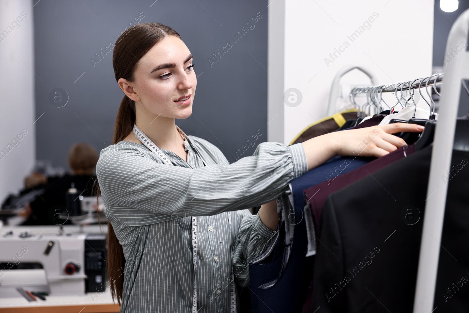 Photo of Atelier. Young woman working in professional workshop