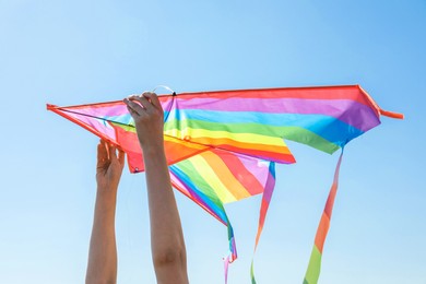 Photo of Woman with kite on sunny day, closeup