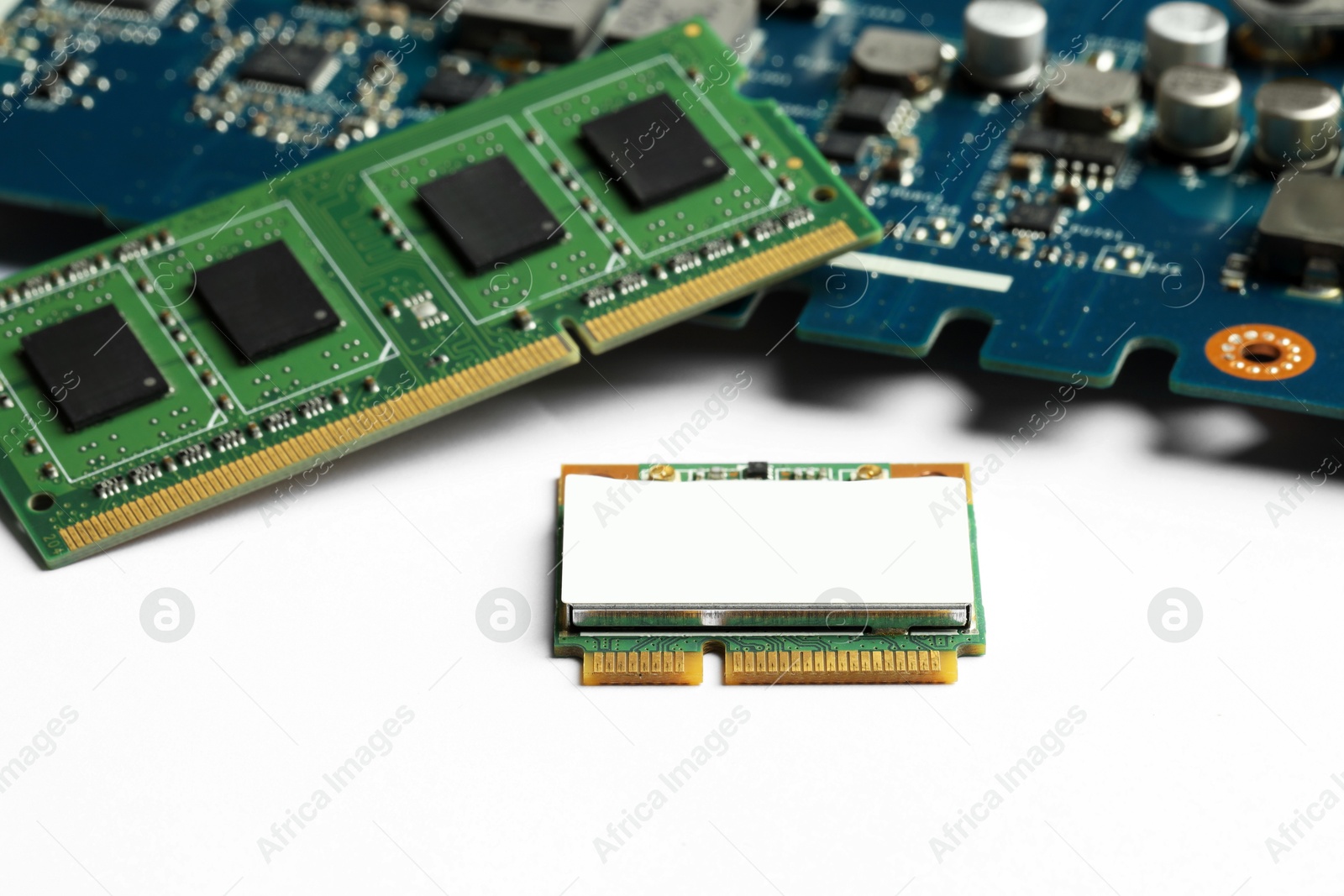 Photo of Wi-Fi card, RAM chip and computer circuit board isolated on white. Electronic engineering