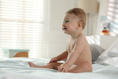 Photo of Cute little baby on bed at home