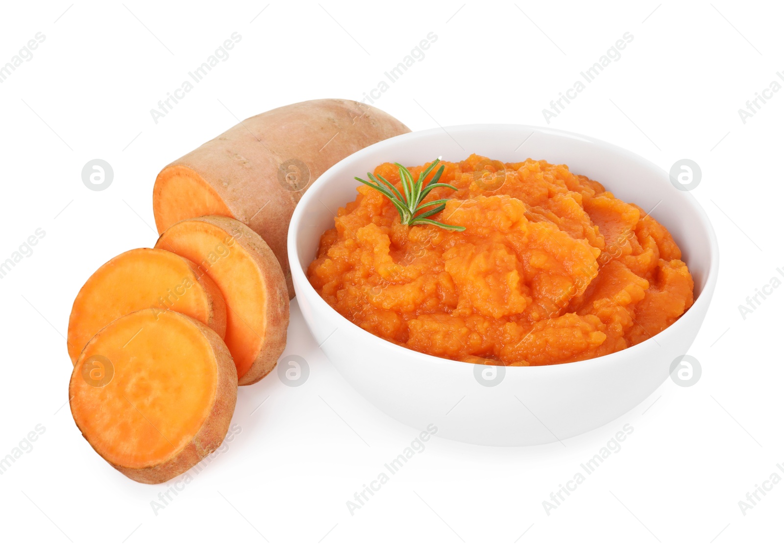 Photo of Tasty mashed sweet potato with rosemary in bowl and fresh cut vegetable isolated on white