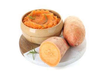 Photo of Tasty mashed sweet potato with rosemary in bowl and fresh vegetables isolated on white