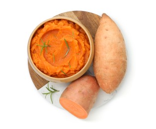 Photo of Tasty mashed sweet potato with rosemary in bowl and fresh vegetables isolated on white, top view