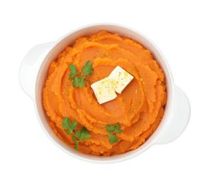 Photo of Tasty mashed sweet potato with butter and parsley in bowl isolated on white, top view