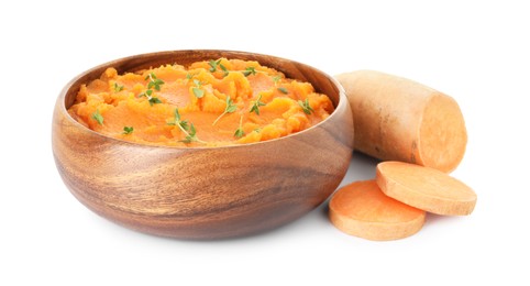 Photo of Tasty mashed sweet potato with thyme in bowl and cut vegetable isolated on white