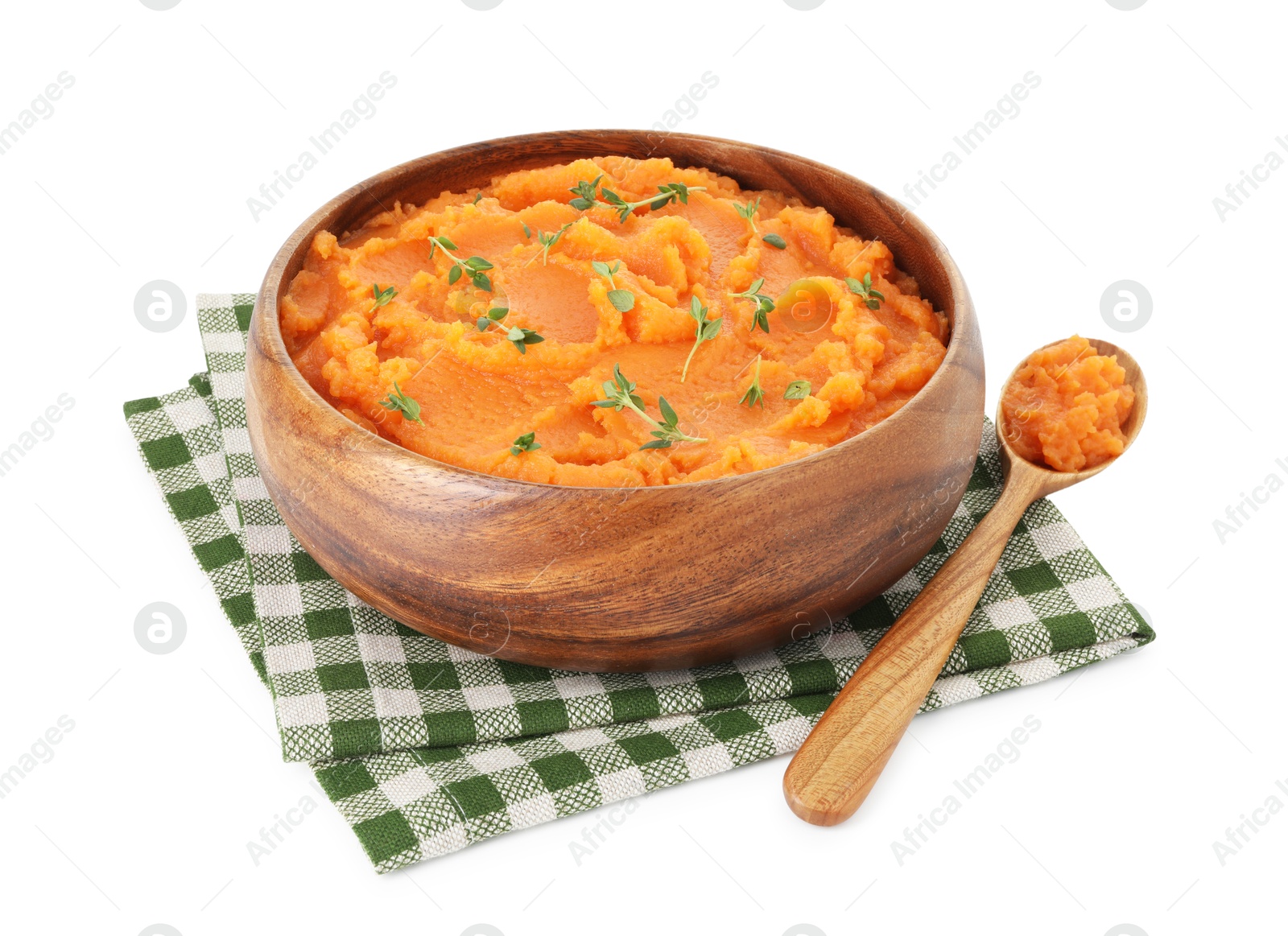 Photo of Tasty mashed sweet potato with thyme in bowl and spoon isolated on white