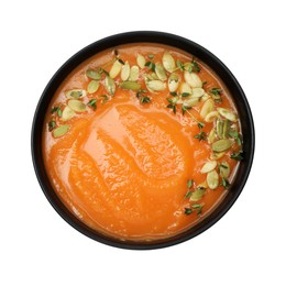 Photo of Delicious sweet potato soup with pumpkin seeds in bowl isolated on white, top view