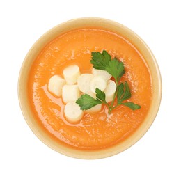 Photo of Delicious sweet potato soup with croutons in bowl isolated on white, top view